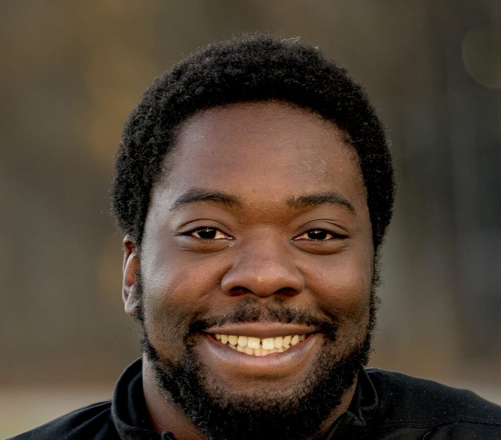 vertical shot attractive african american male smiling camera e1788993487568 - Nexuraweb